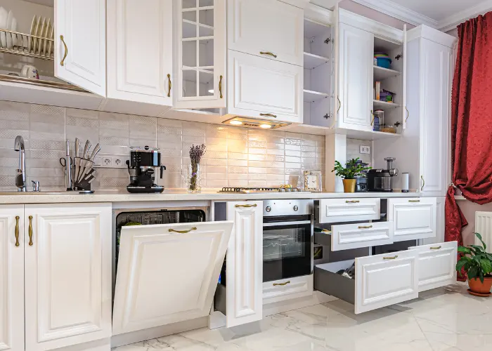 Brand new white kitchen cabinets with glass insets and open drawers & cabinet doors